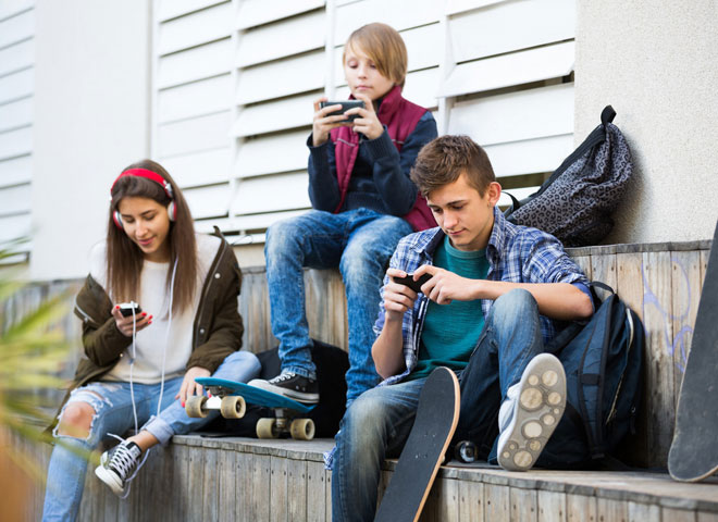 Teens using smartphones